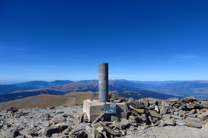 monument on a mountain peak at the pyrenees