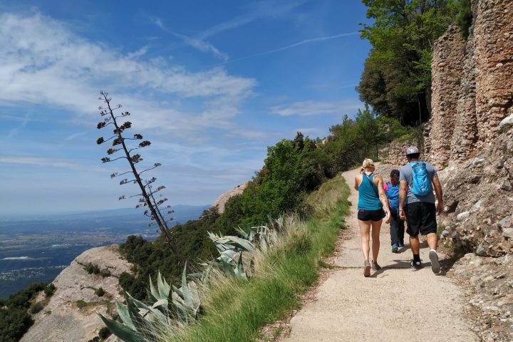 a man riding a bike down a dirt trail