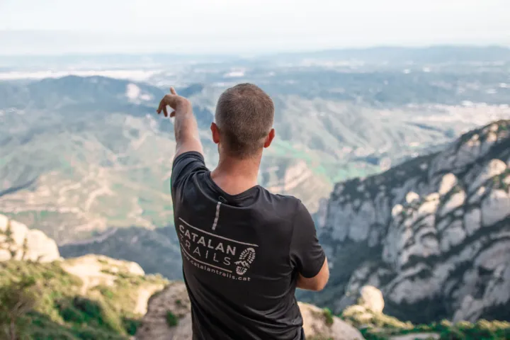 a man standing in front of a mountain