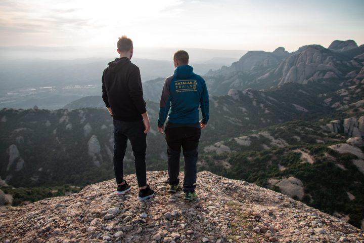 a man standing on a rocky hill