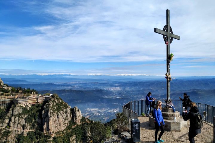 a group of people standing on top of a mountain