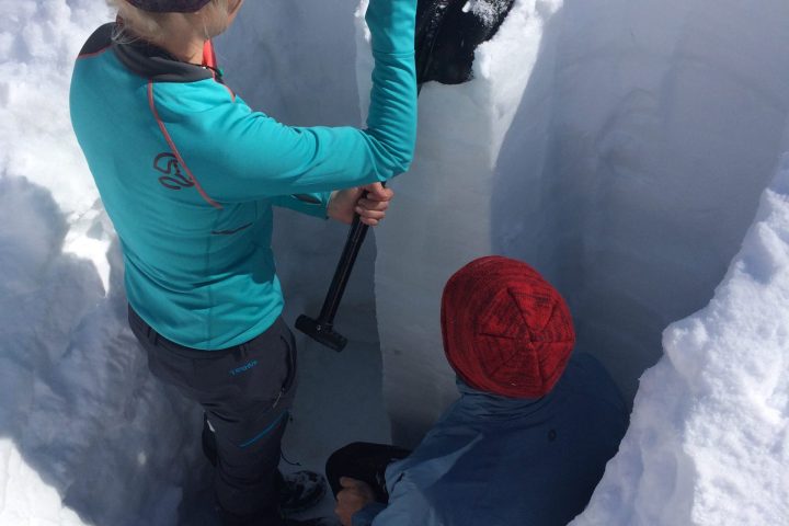 a man that is standing in the snow