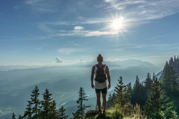 a man standing on top of a mountain