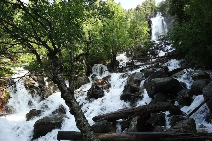a waterfall surrounded by snow