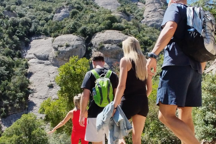 a group of people standing on top of a mountain